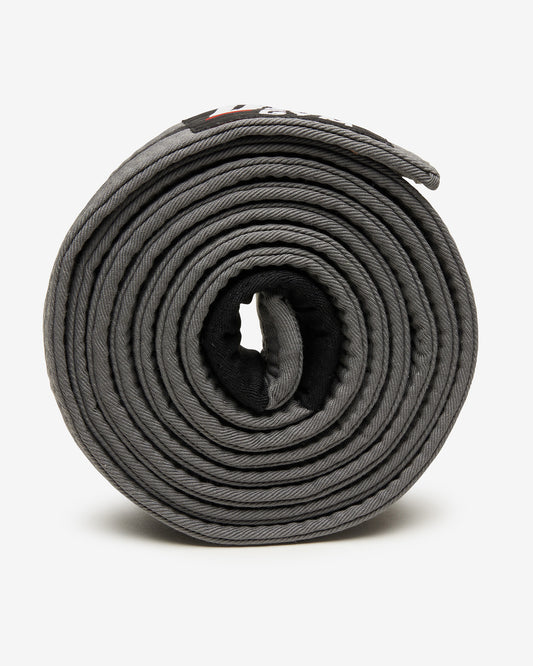 Gray UFC Gym belt with a black stripe on a white background on it's side