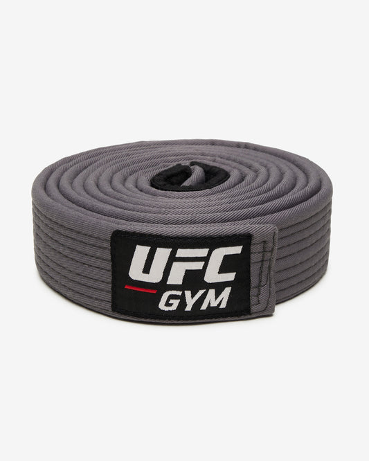 Gray UFC Gym belt on a white background facing forward