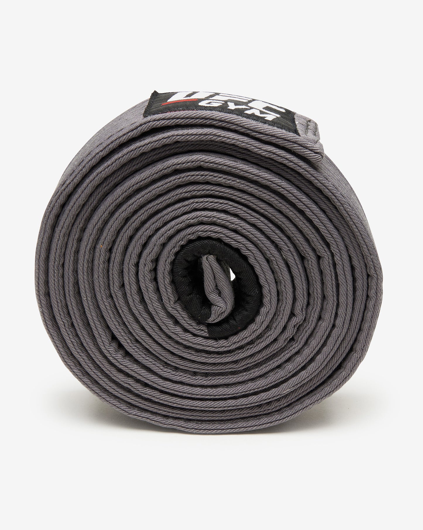 Gray UFC Gym belt on a white background on it's side