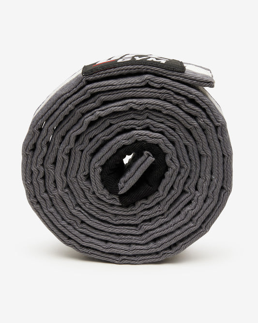 Gray UFC Gym belt with a white stripe on a white background on its side