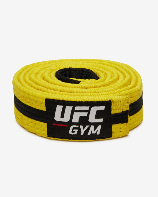 Yellow UFC Gym belt with a black stripe on a white background facing forward