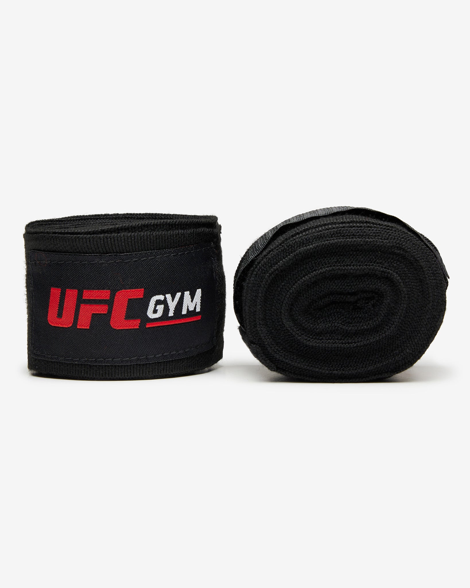 Two black TD 180 Hand Wraps by UFC Gym with padded wrist loops and long straps, inspired by MMA wraps, are displayed side by side on a white background—ideal for injury prevention during intense training.
