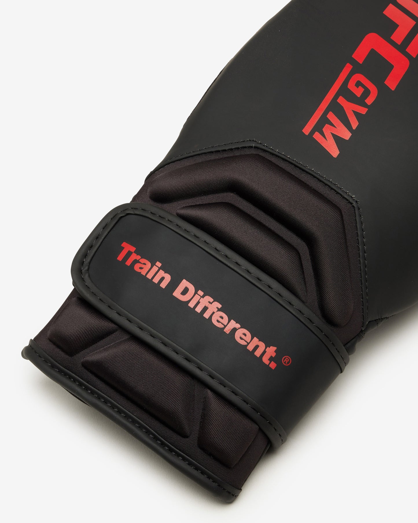 TD ADULT BOXING GLOVE BLACK by UFC Gym on a white background. Glove features the red UFC Gym logo and Train Different. slogan.
