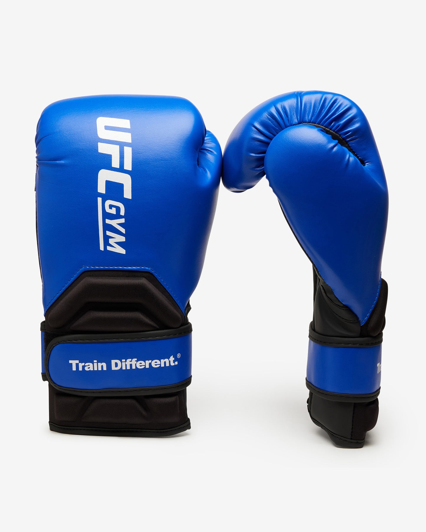 Two blue TD ADULT BOXING GLOVE BLUE by UFC Gym are shown on a white background; one displays the UFC Gym and “Train Different.” text, while the other reveals both back and palm sides, highlighting their protective performance design.