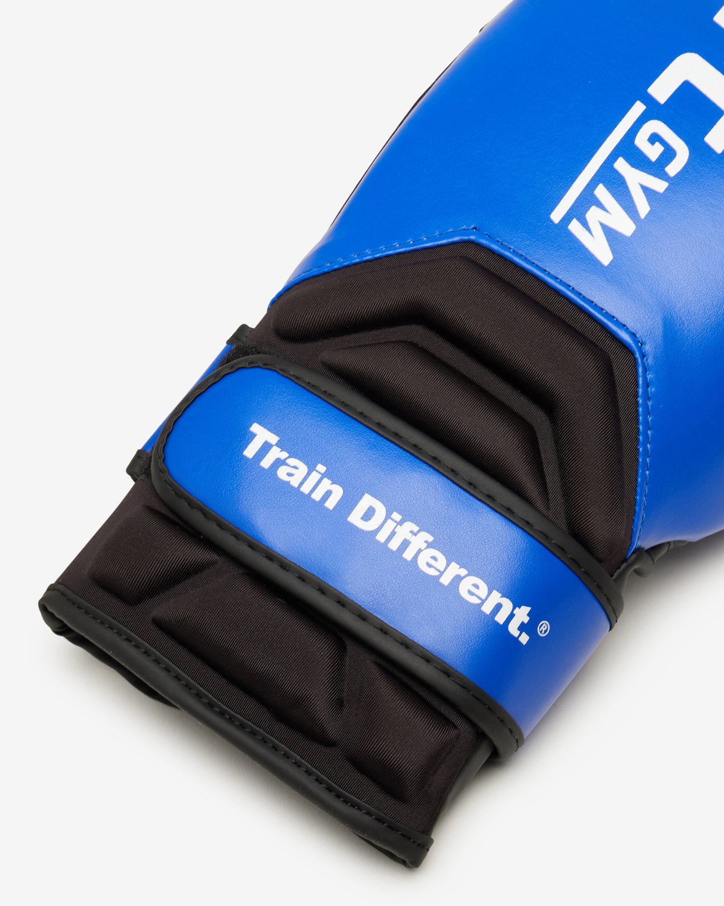 Blue boxing glove with black wrist strap and 'Train Different' text on a white background
