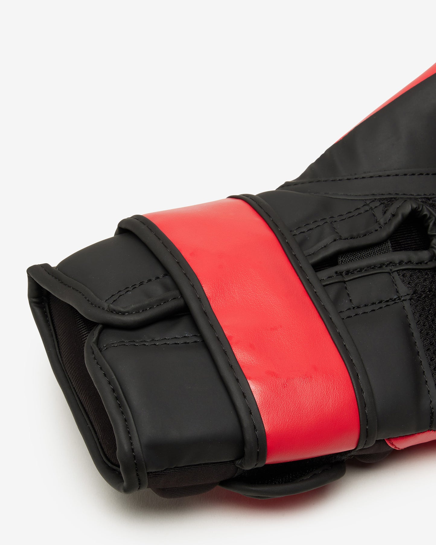 Close-up of black and red boxing gloves on a white background