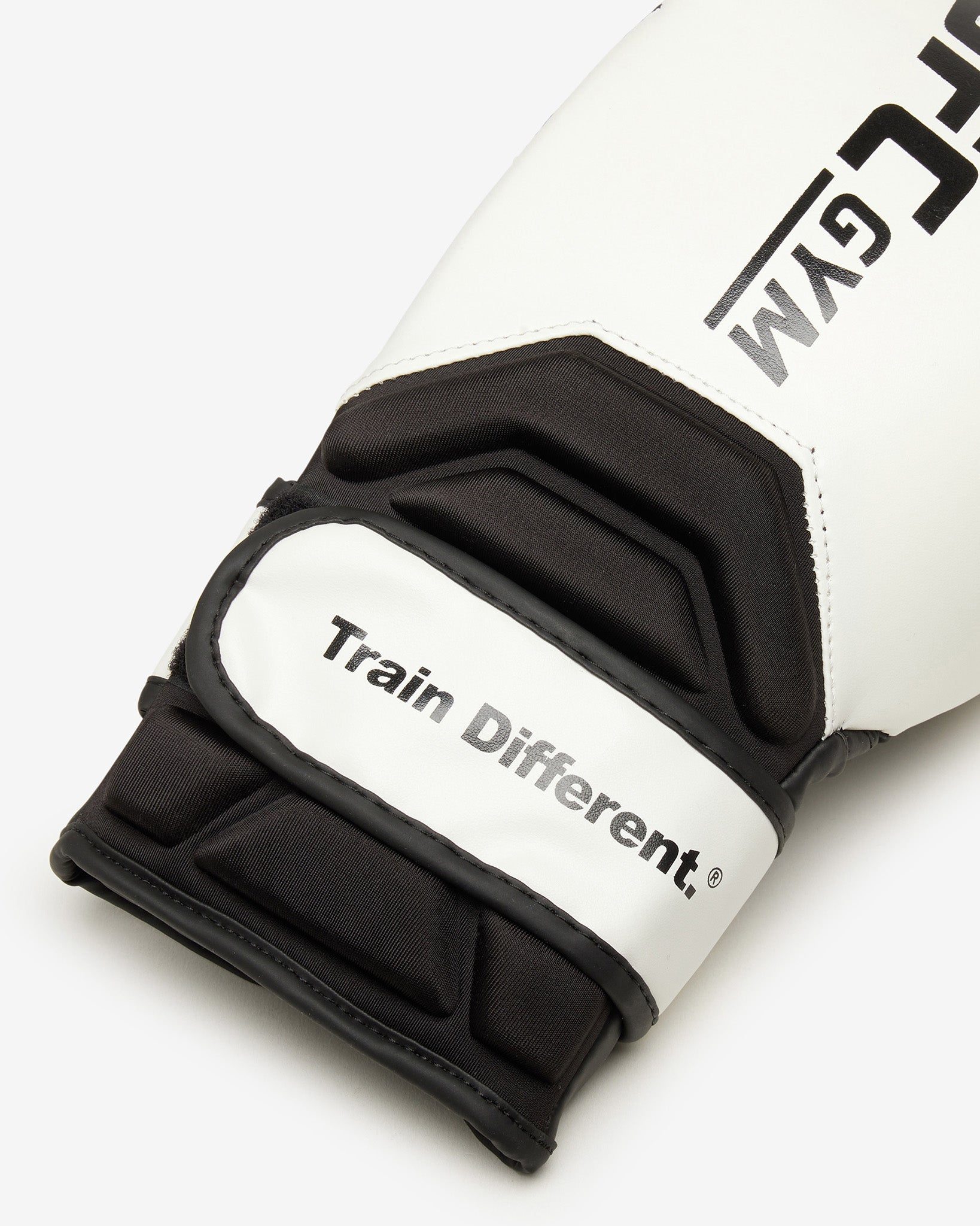 White and black training glove with 'Train Different' and 'Gym' branding on a white background