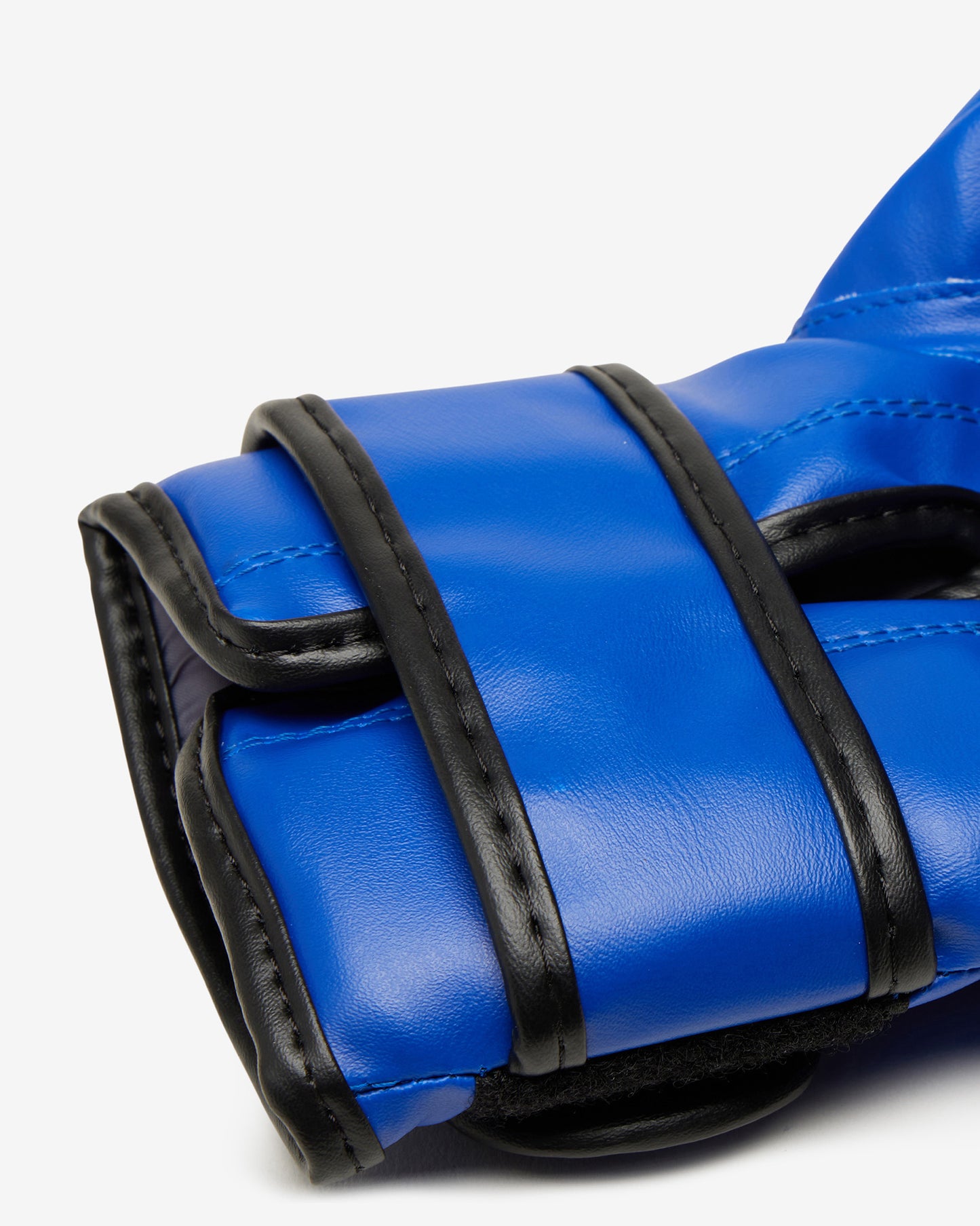 Close-up of a blue boxing glove with black trim on a white background