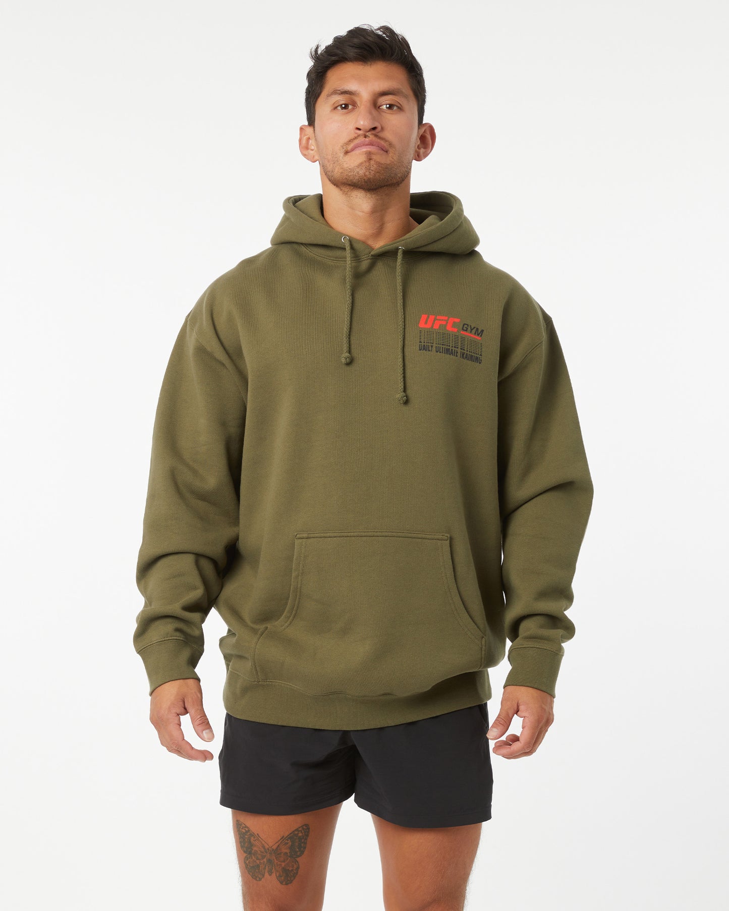 Person wearing a green hoodie with UFC branding on a white background