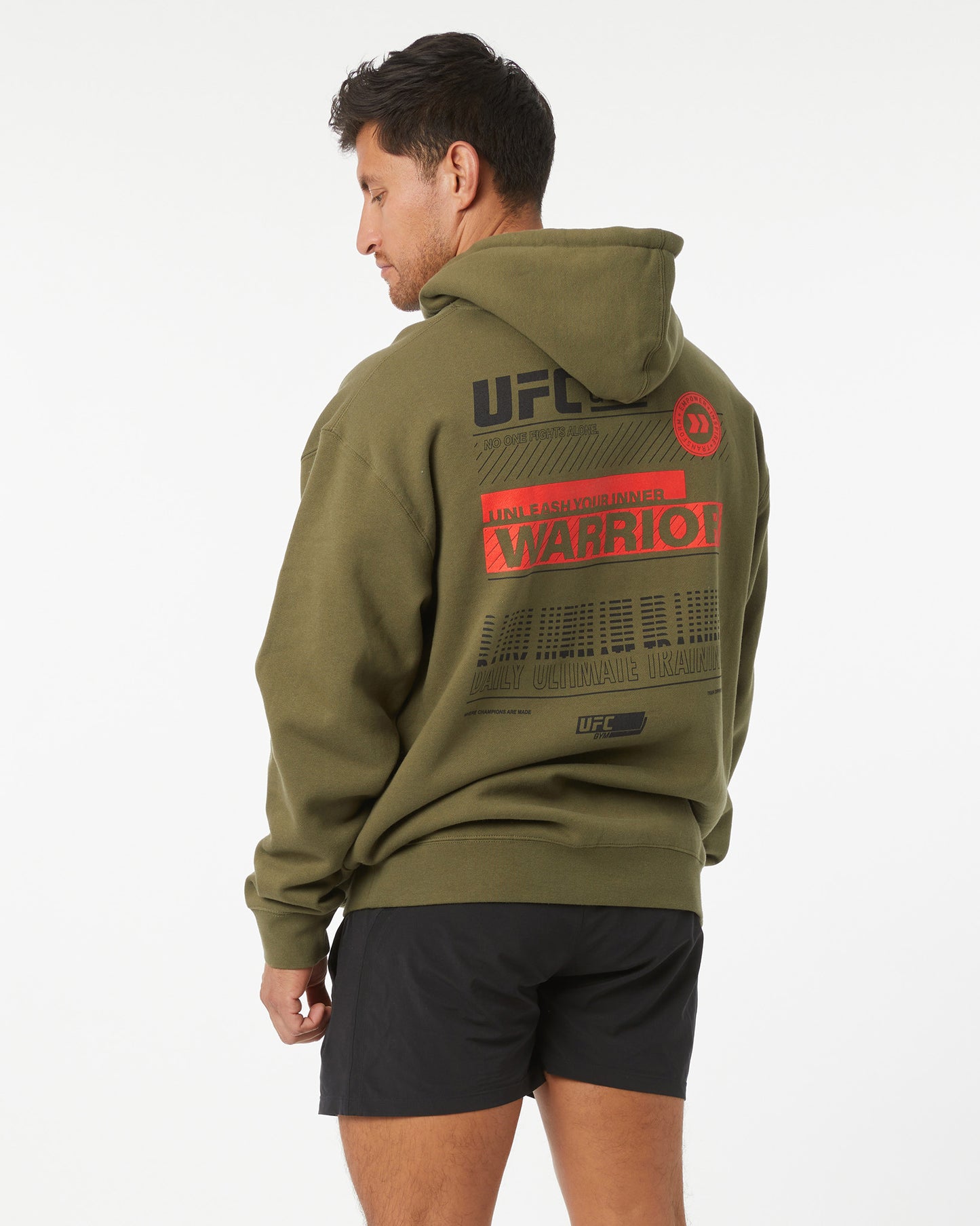 Person wearing a green UFC hoodie with branding on the back against a white background