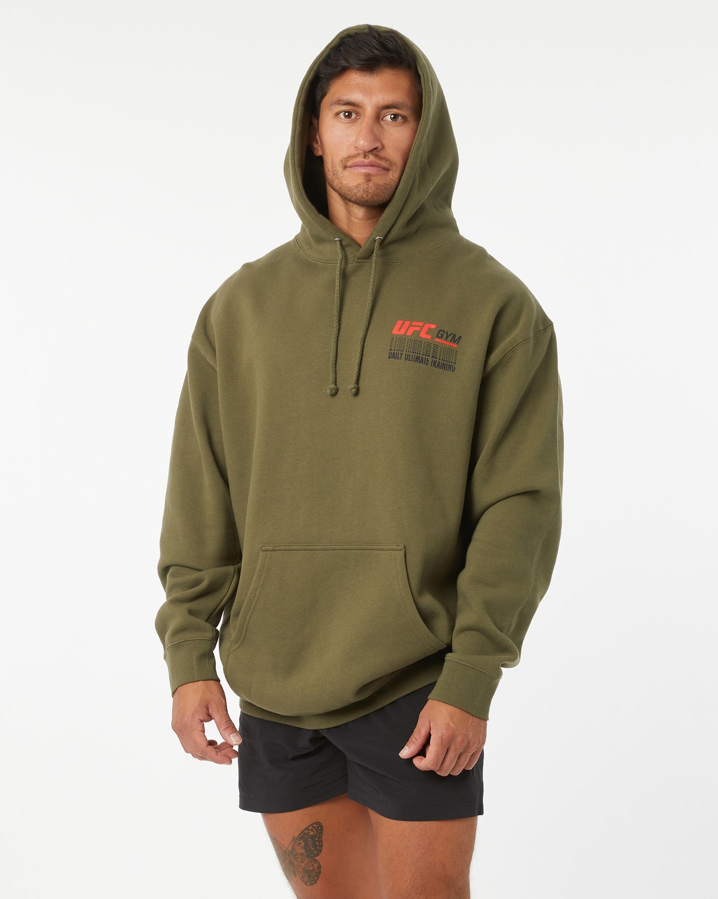 Person wearing a green hoodie with UFC branding on a white background