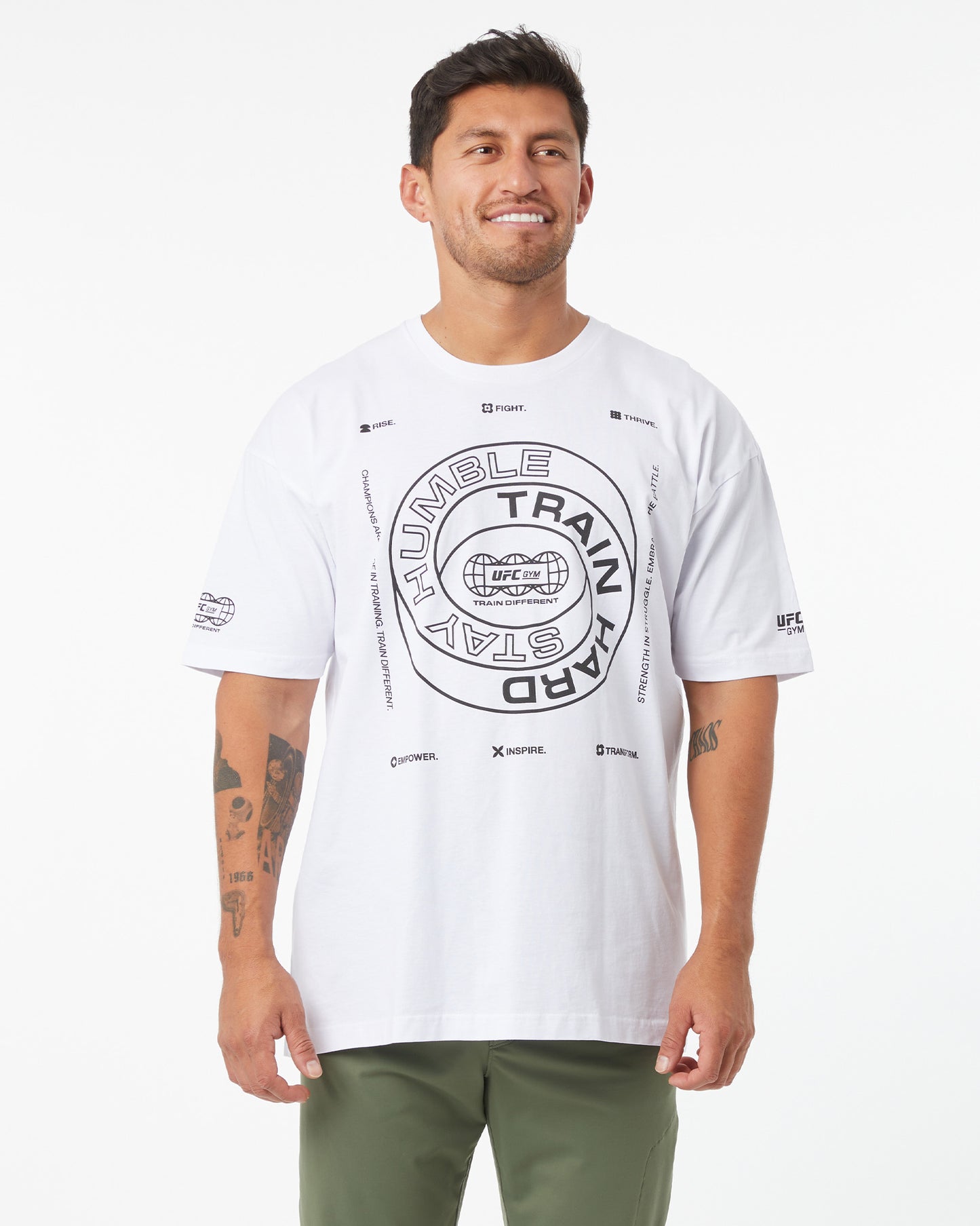 Man wearing a white t-shirt with text and graphics on a white background