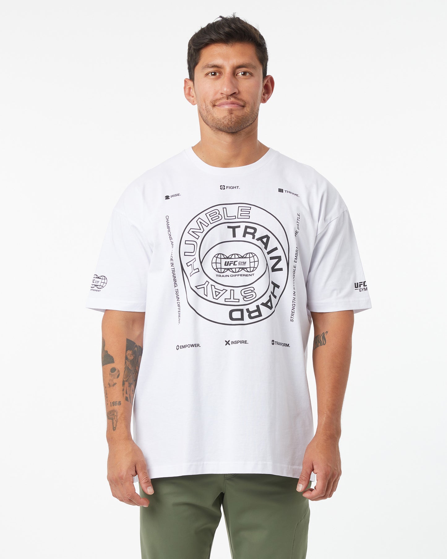 Man wearing a white t-shirt with graphic design on a white background