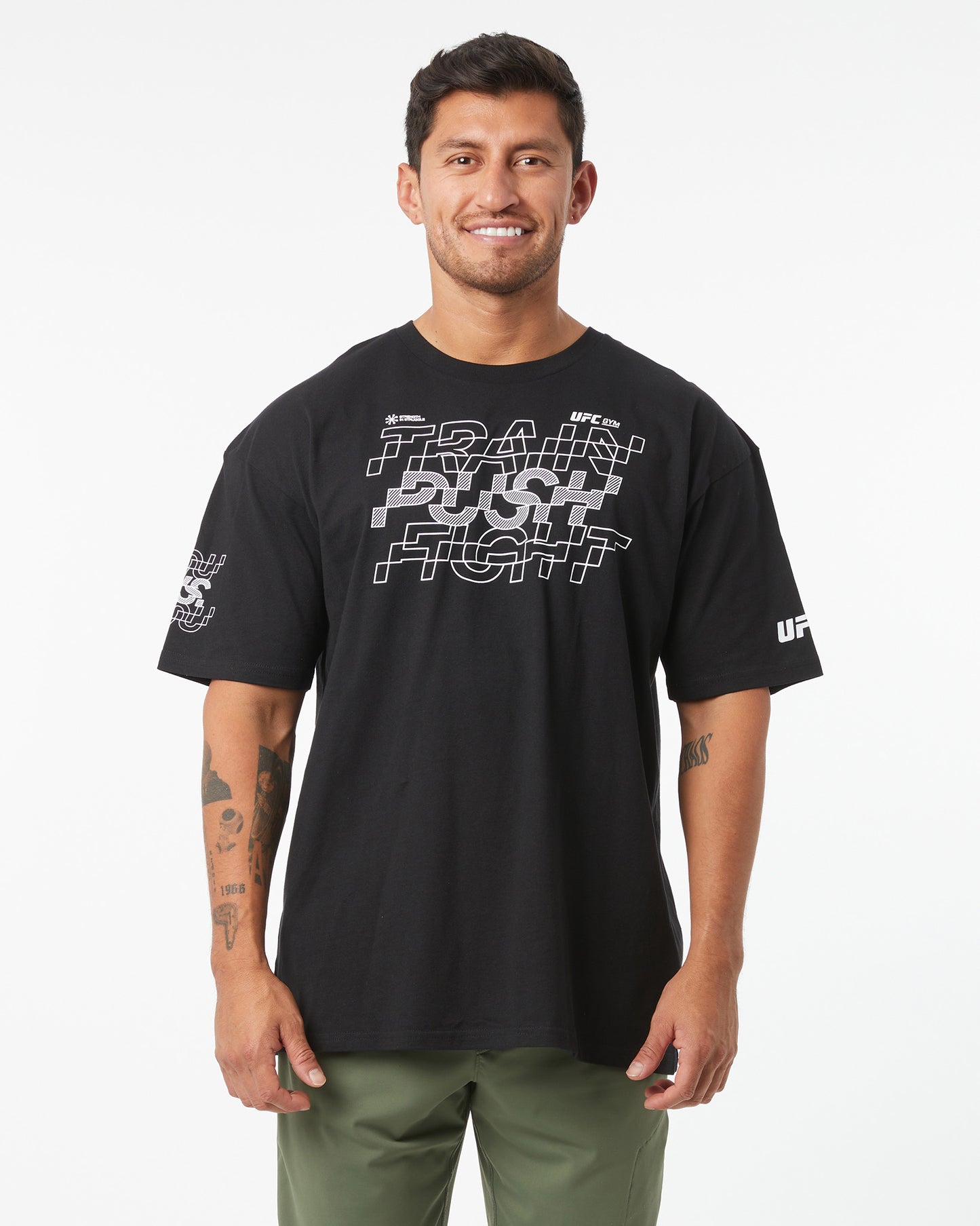 Man wearing a black t-shirt with white graphics and text on a white background
