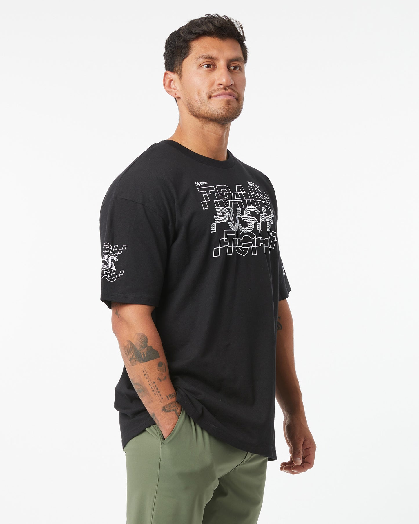Man wearing a black t-shirt with text on a white background