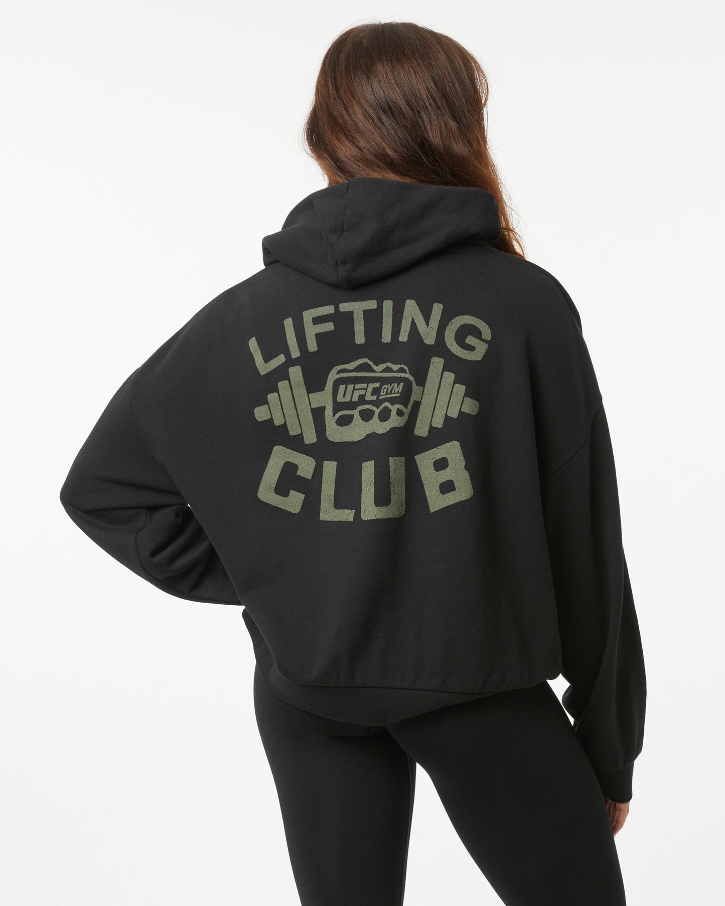 Person wearing a black hoodie with 'Lifting Club' text and UFC logo on the back.