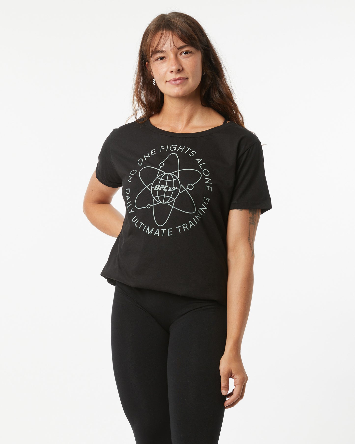 Woman wearing a black t-shirt with white text and graphics on a white background