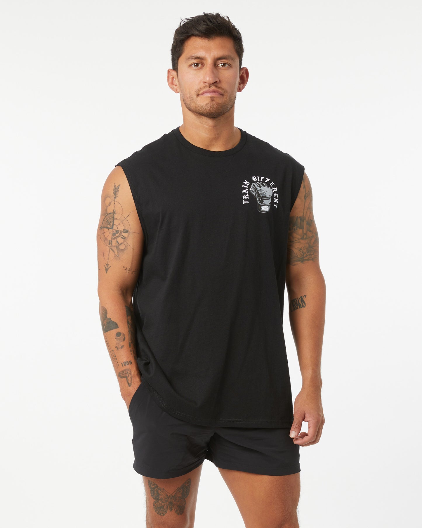 Man wearing a black sleeveless shirt with a logo on a white background