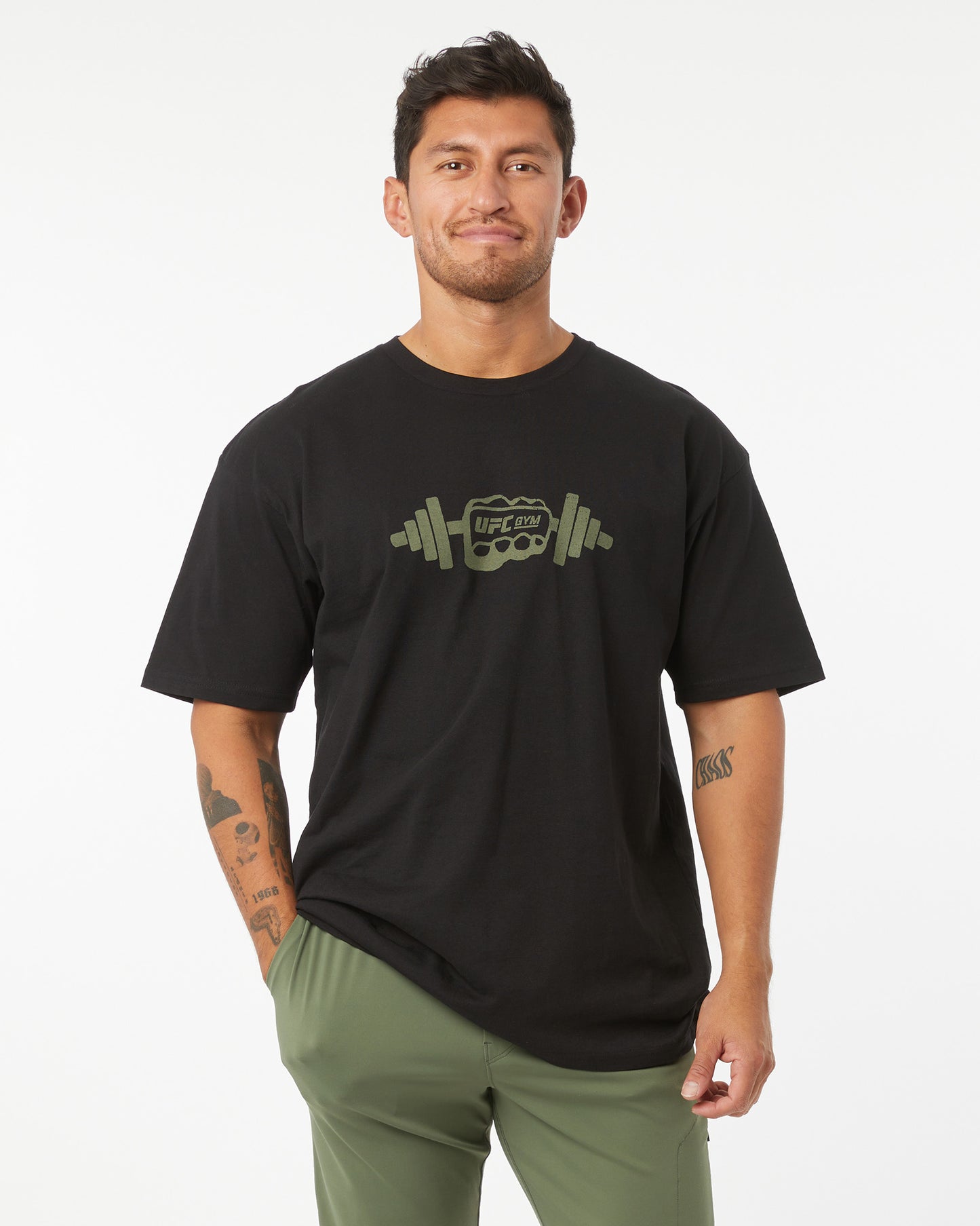 Man wearing a black t-shirt with a graphic design on a white background