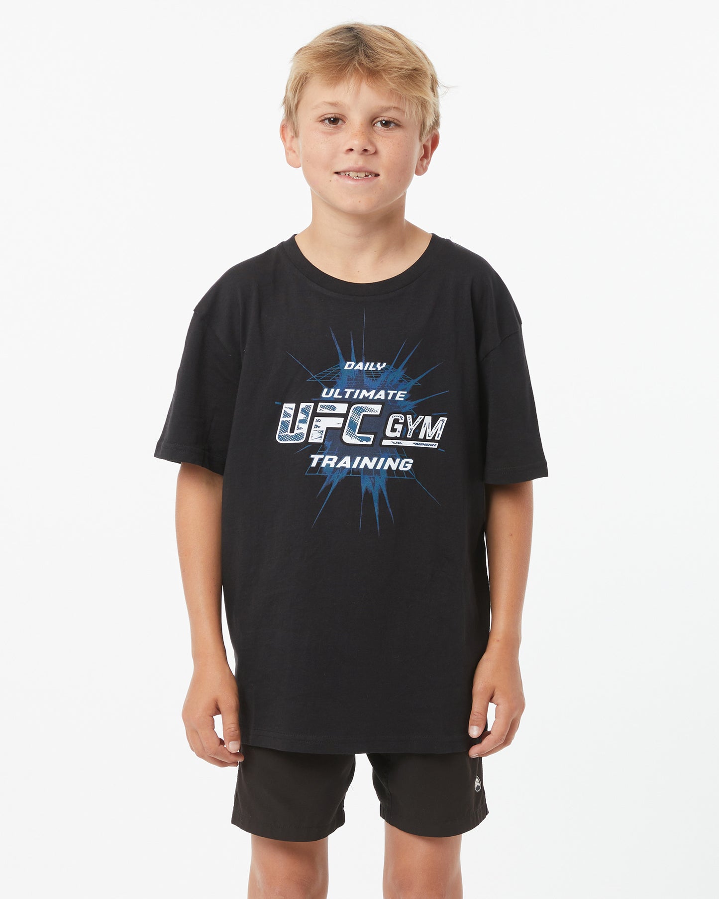 Child wearing a black T-Shirt with UFC GYM logo facing forward