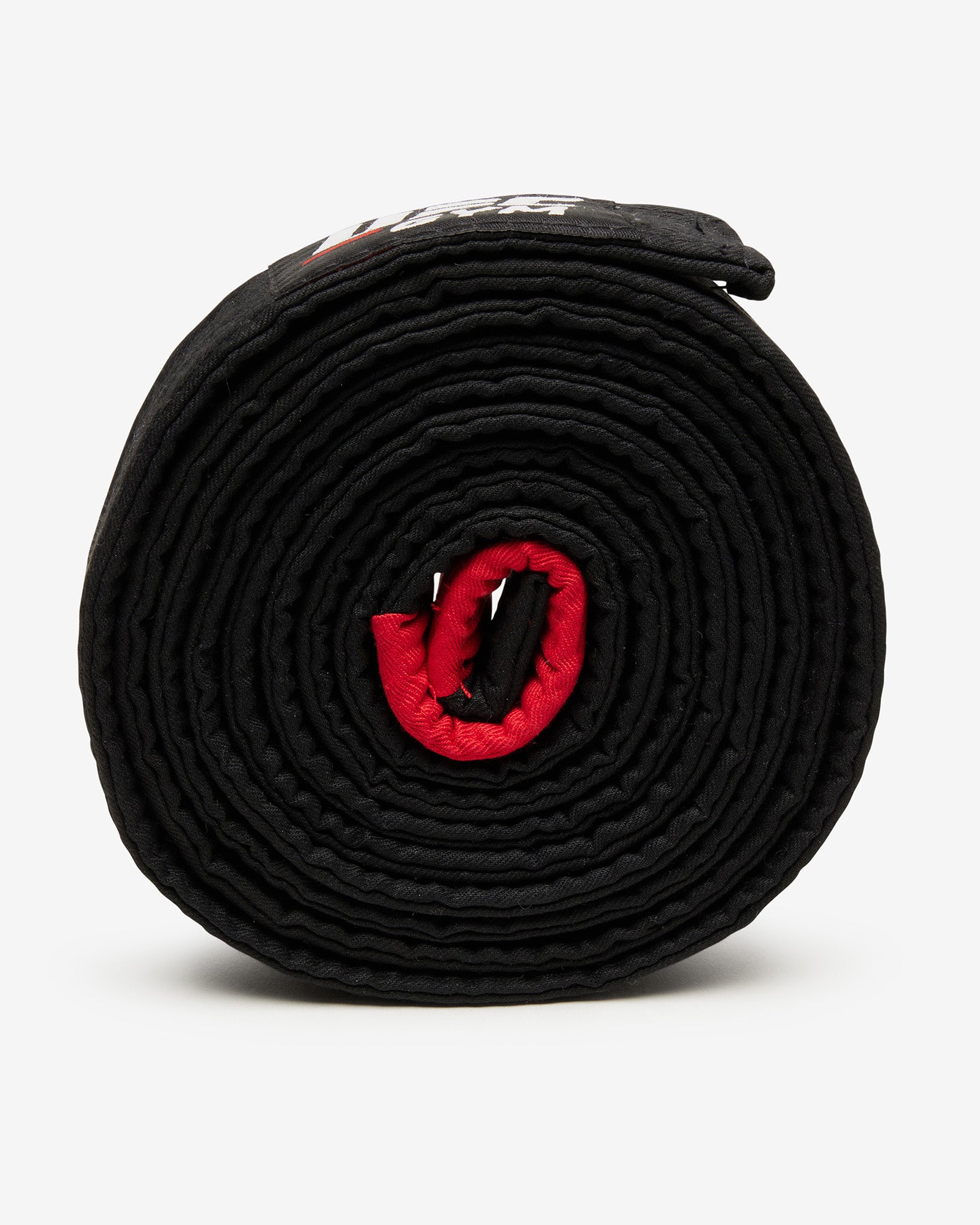 Black belt with a red center on a white background side-facing view