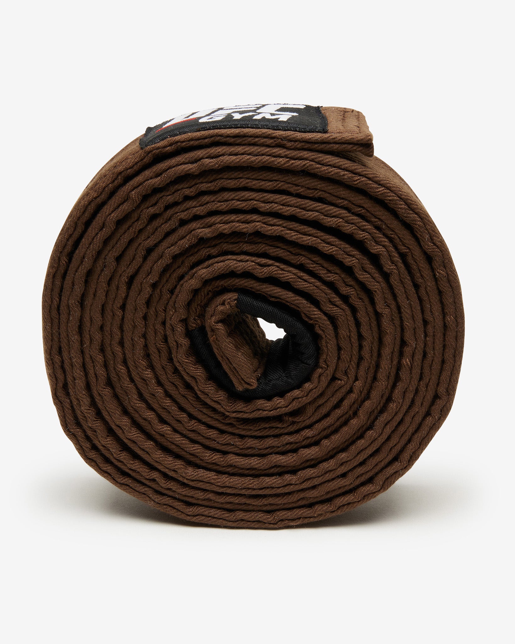 Brown belt with a brand label on a white background on it's side