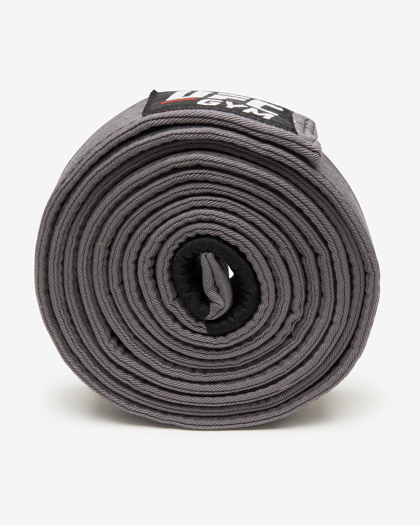 Gray UFC Gym belt on a white background on it's side