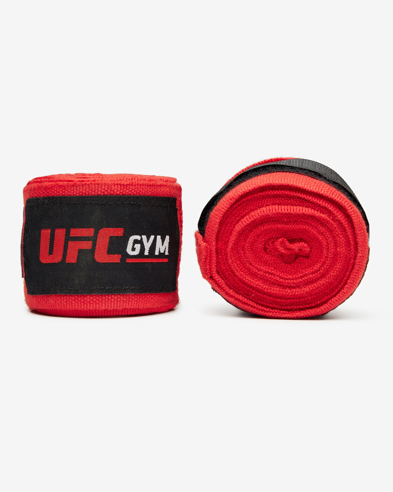 UFC Gym TD 180 HAND WRAPS RED feature black velcro straps and display the UFC Gym logo on each wrap—perfect for MMA training. Shown laid flat on a white background.