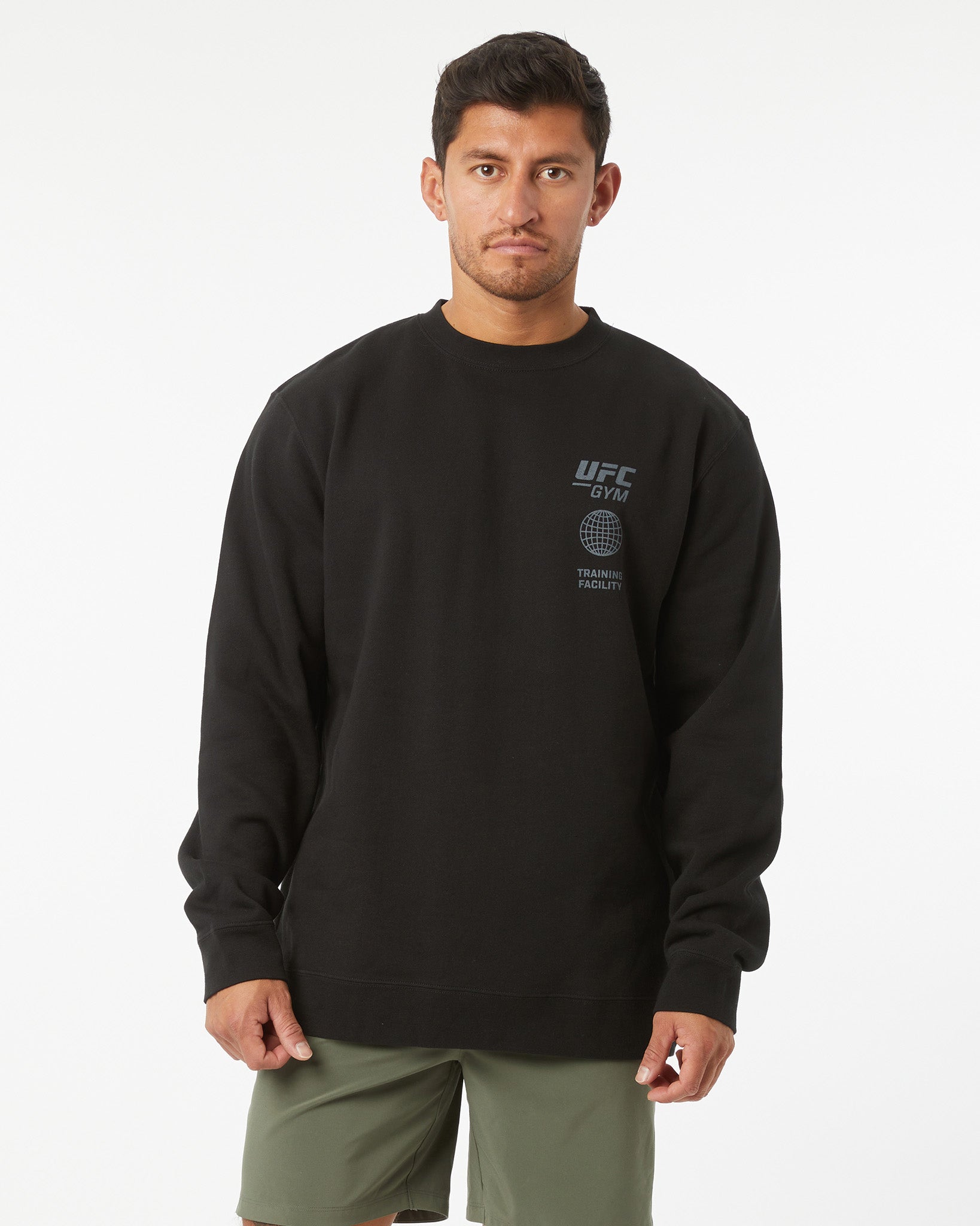 Man wearing a black UFC sweatshirt on a white background