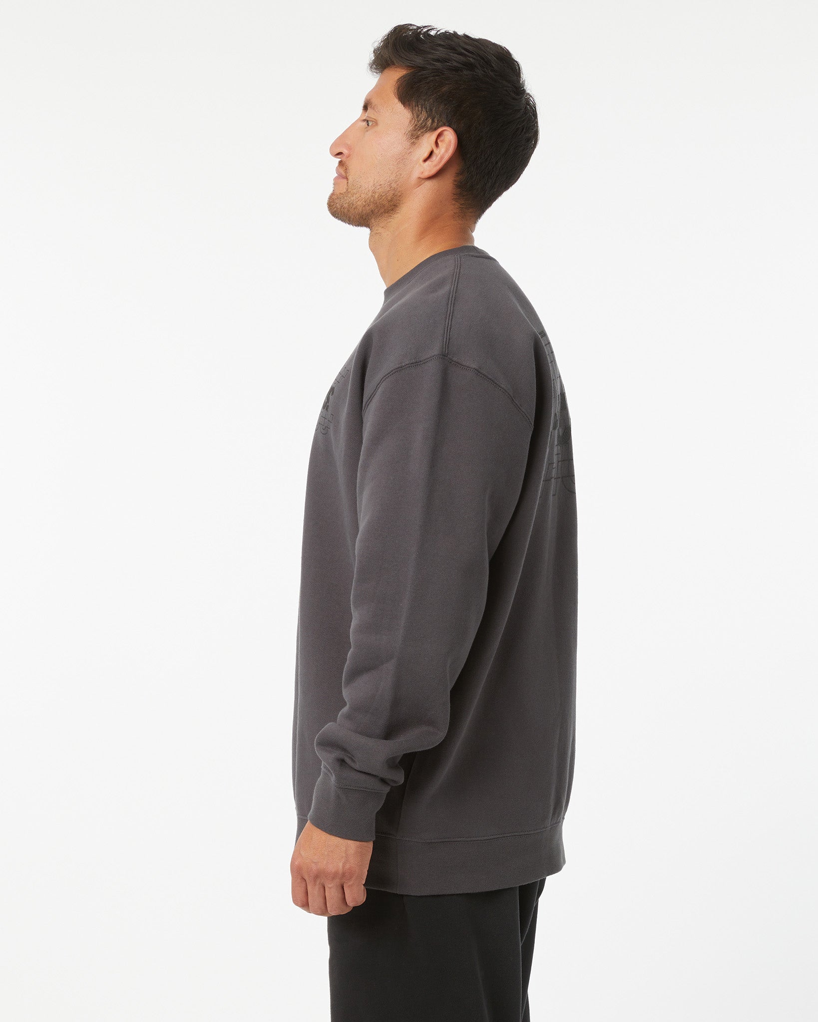 Man wearing a gray sweatshirt on a white background