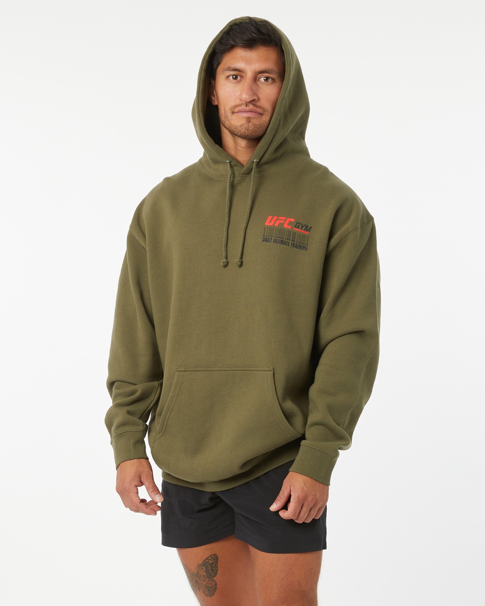 Person wearing a green hoodie with UFC branding on a white background