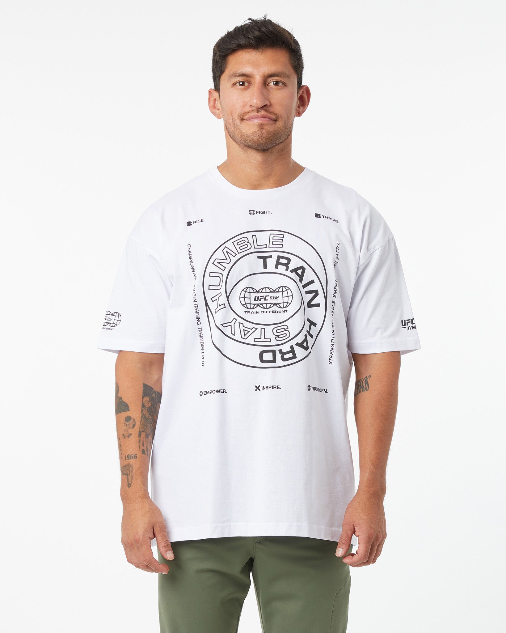 Man wearing a white t-shirt with graphic design on a white background