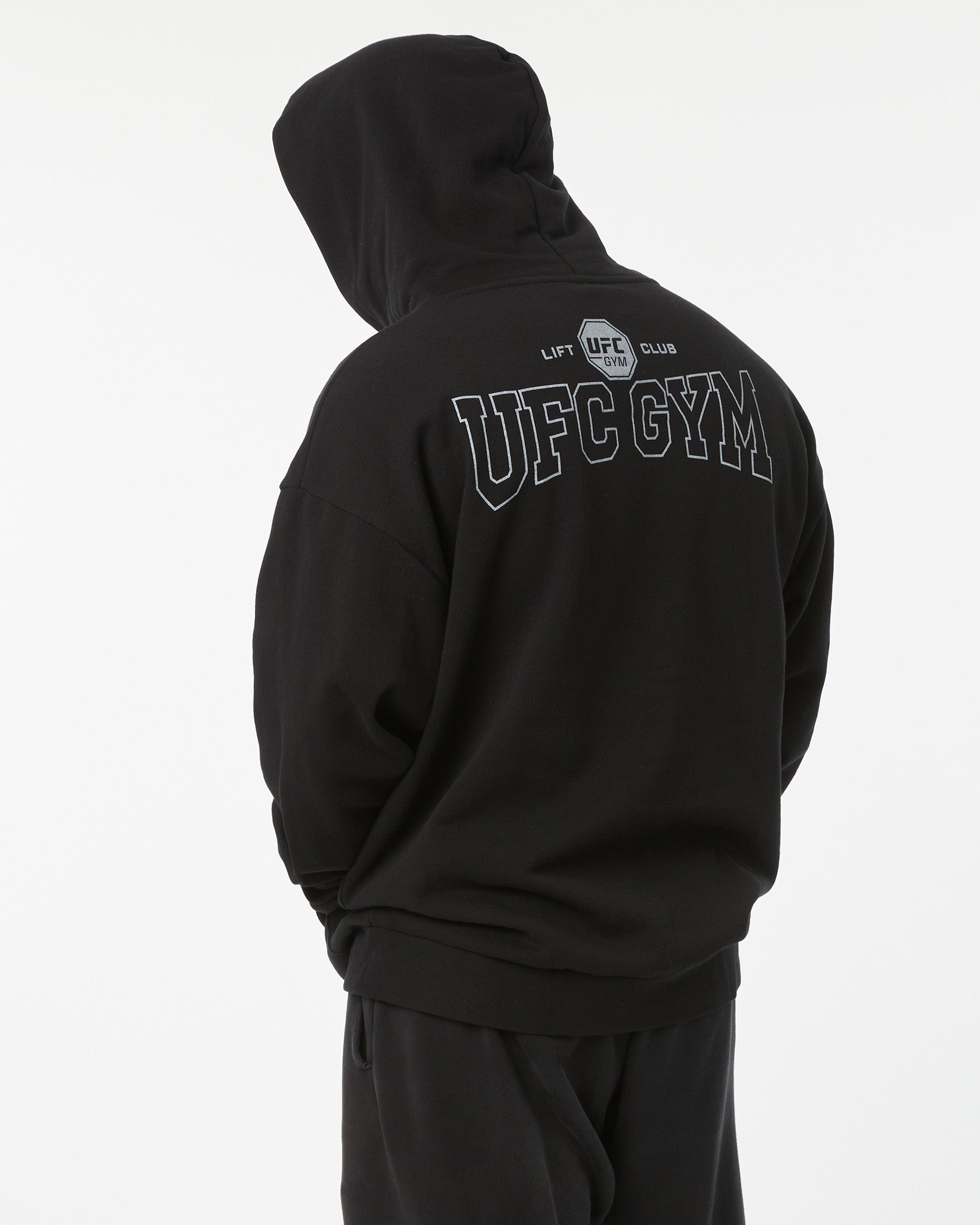 Black hoodie with 'UFC Gym' and 'LIFT CLUB' text on the back against a white background