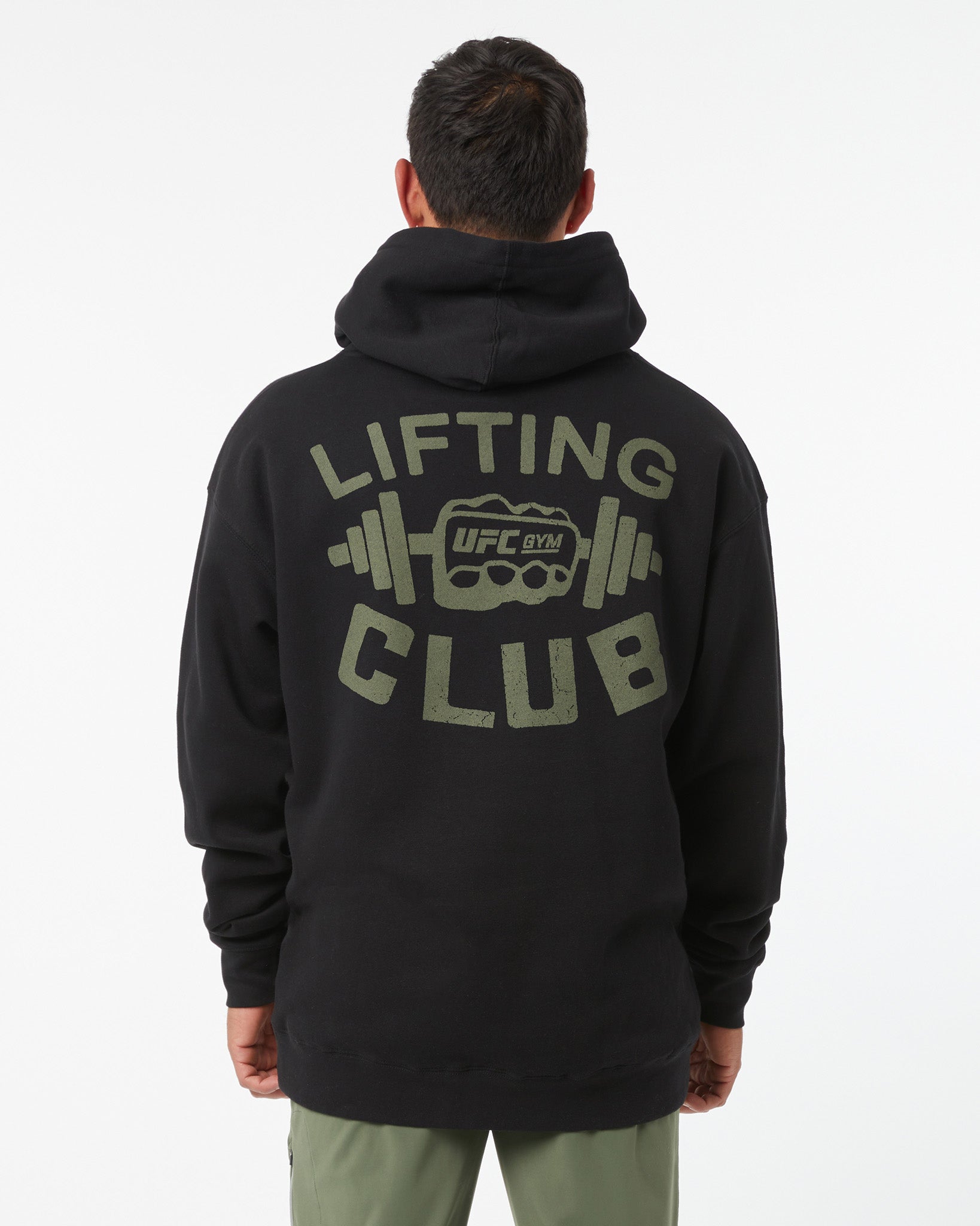 Person wearing a black hoodie with 'Lifting Club' text and UFC logo on the back.