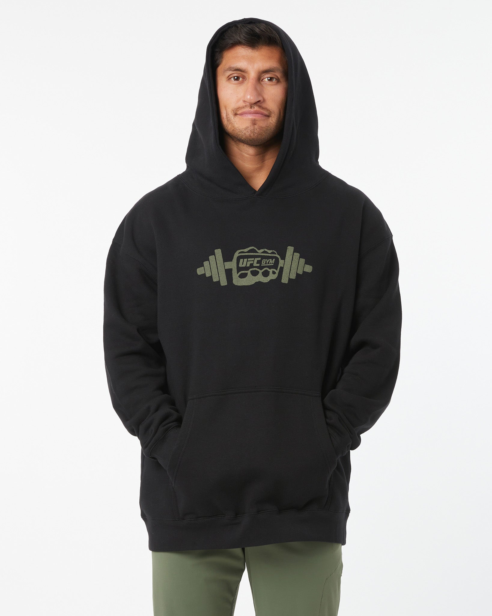 Person wearing a black hoodie with a logo on a white background