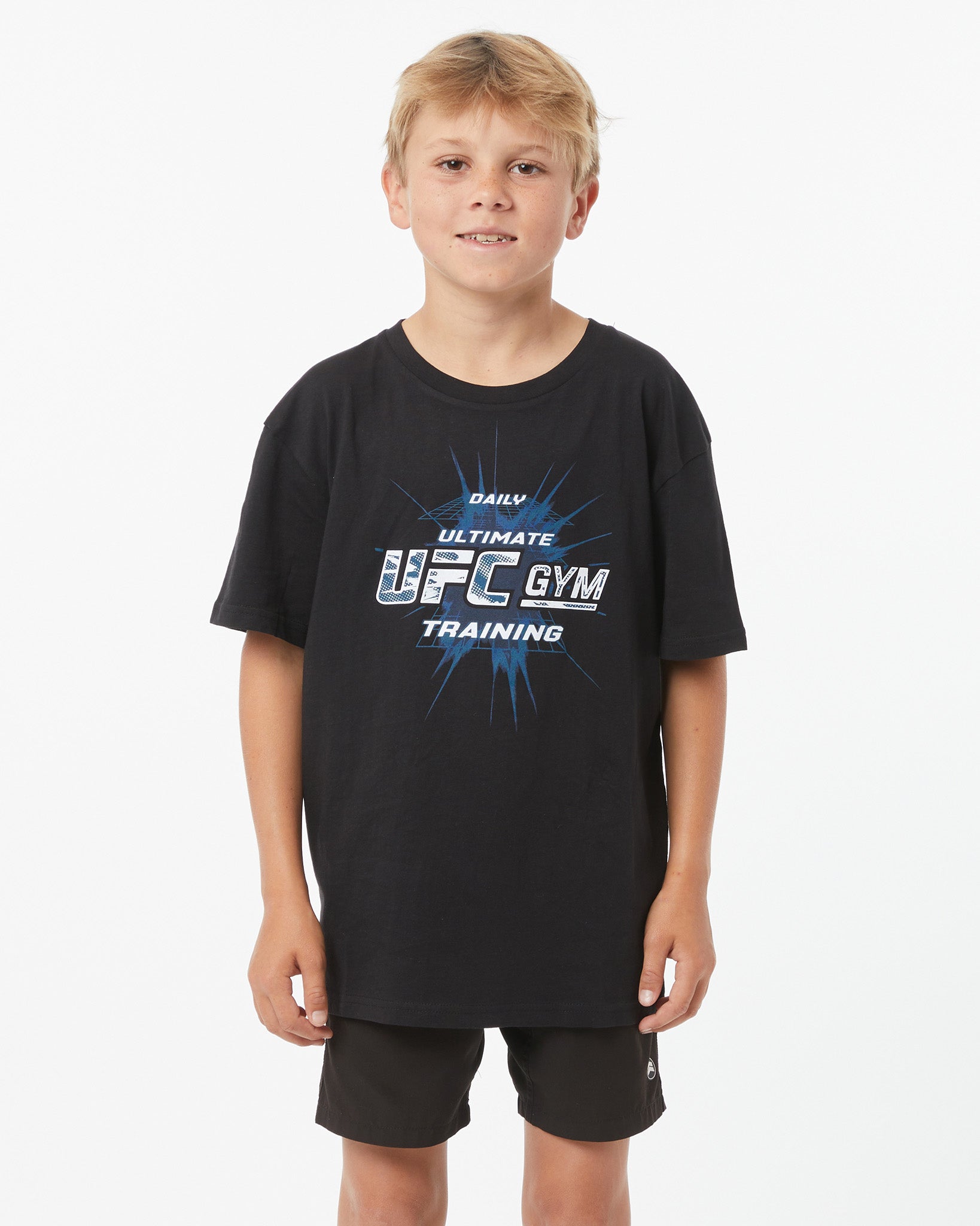Child wearing a black T-Shirt with UFC GYM logo facing forward