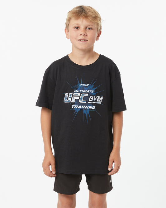 Child wearing a black T-Shirt with UFC GYM logo facing forward